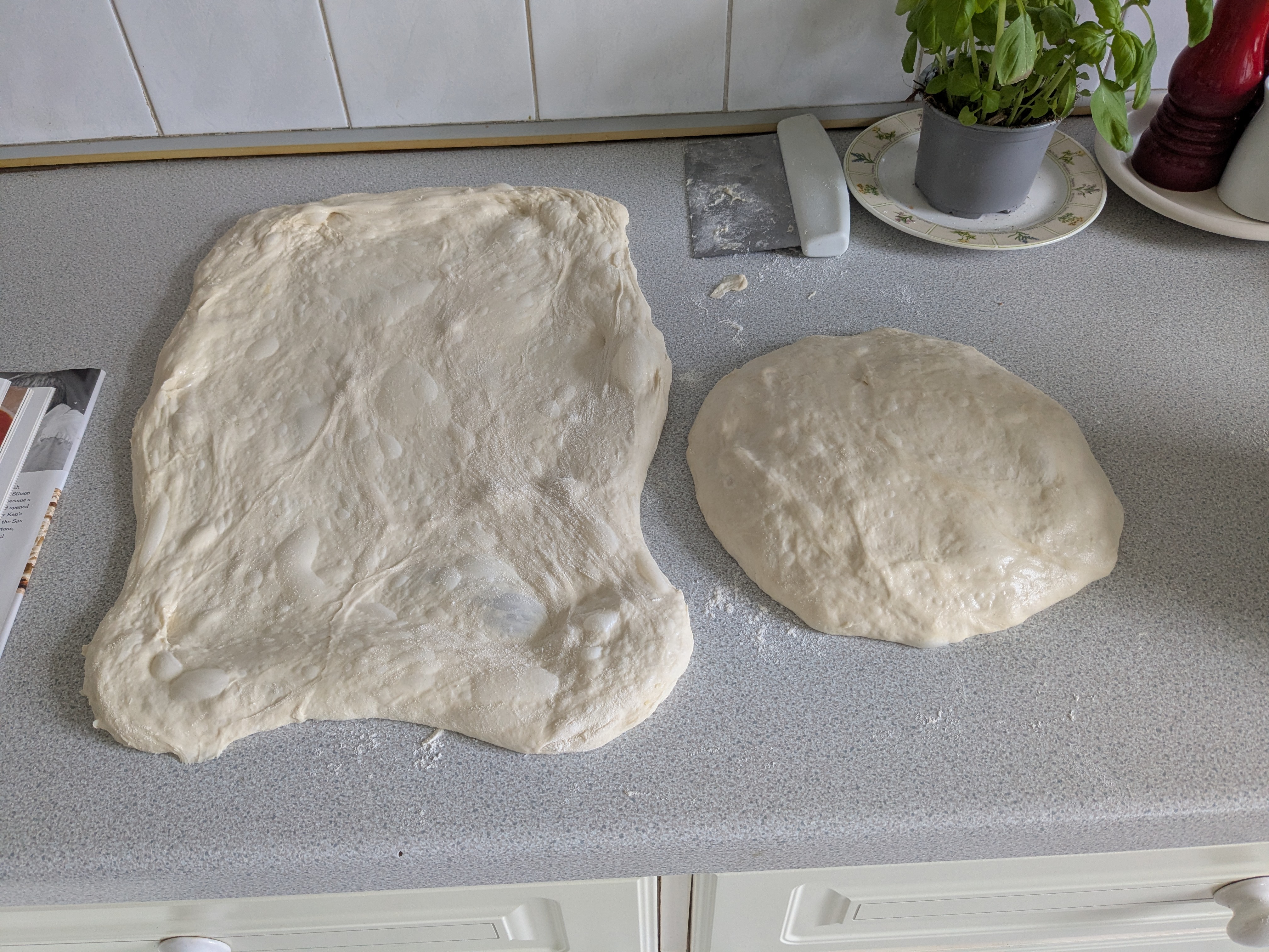 The two dough balls, with one shaped