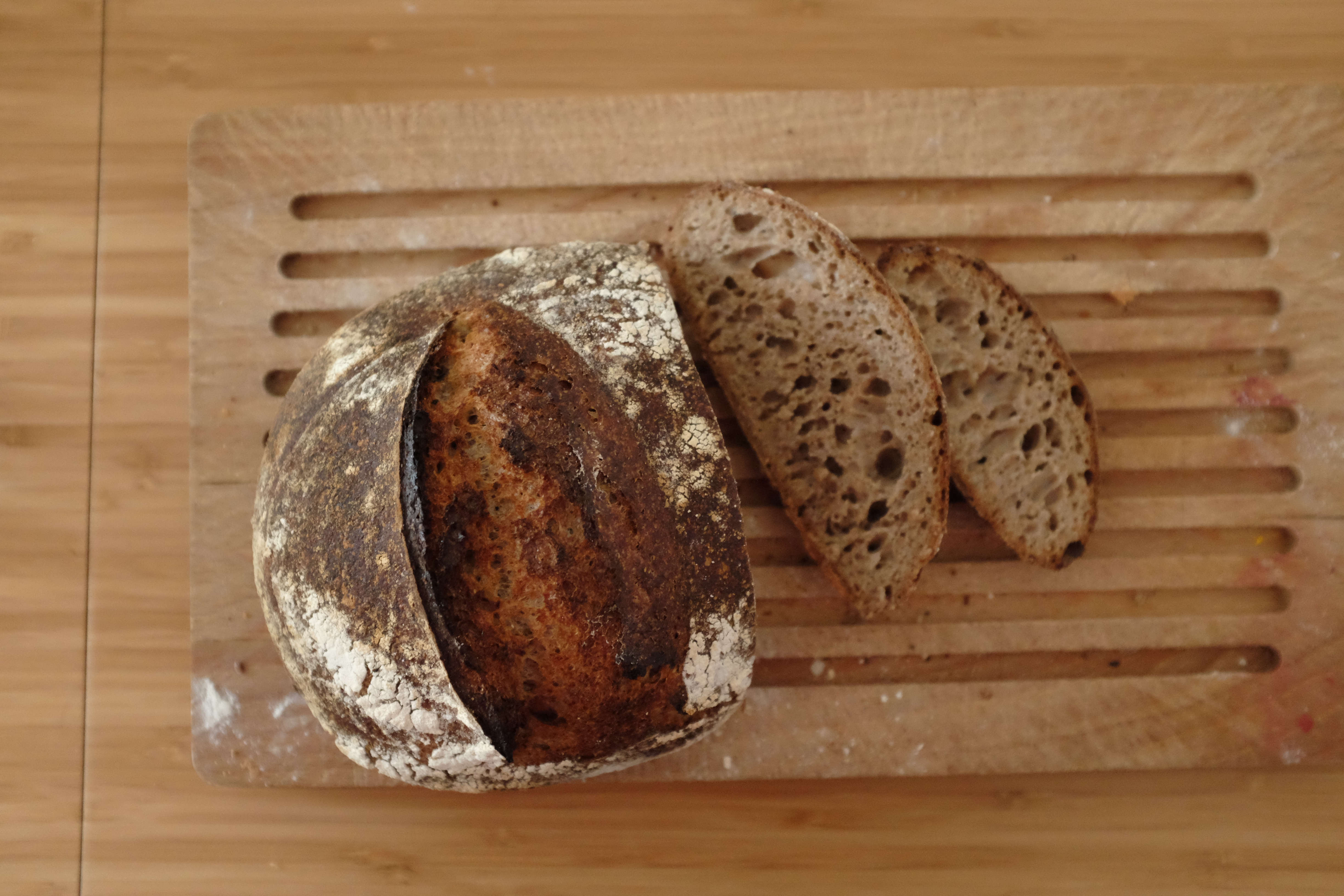 Two cut slices of the “Wholemeal Sourdough with a Splash of Rye (Again)” bread