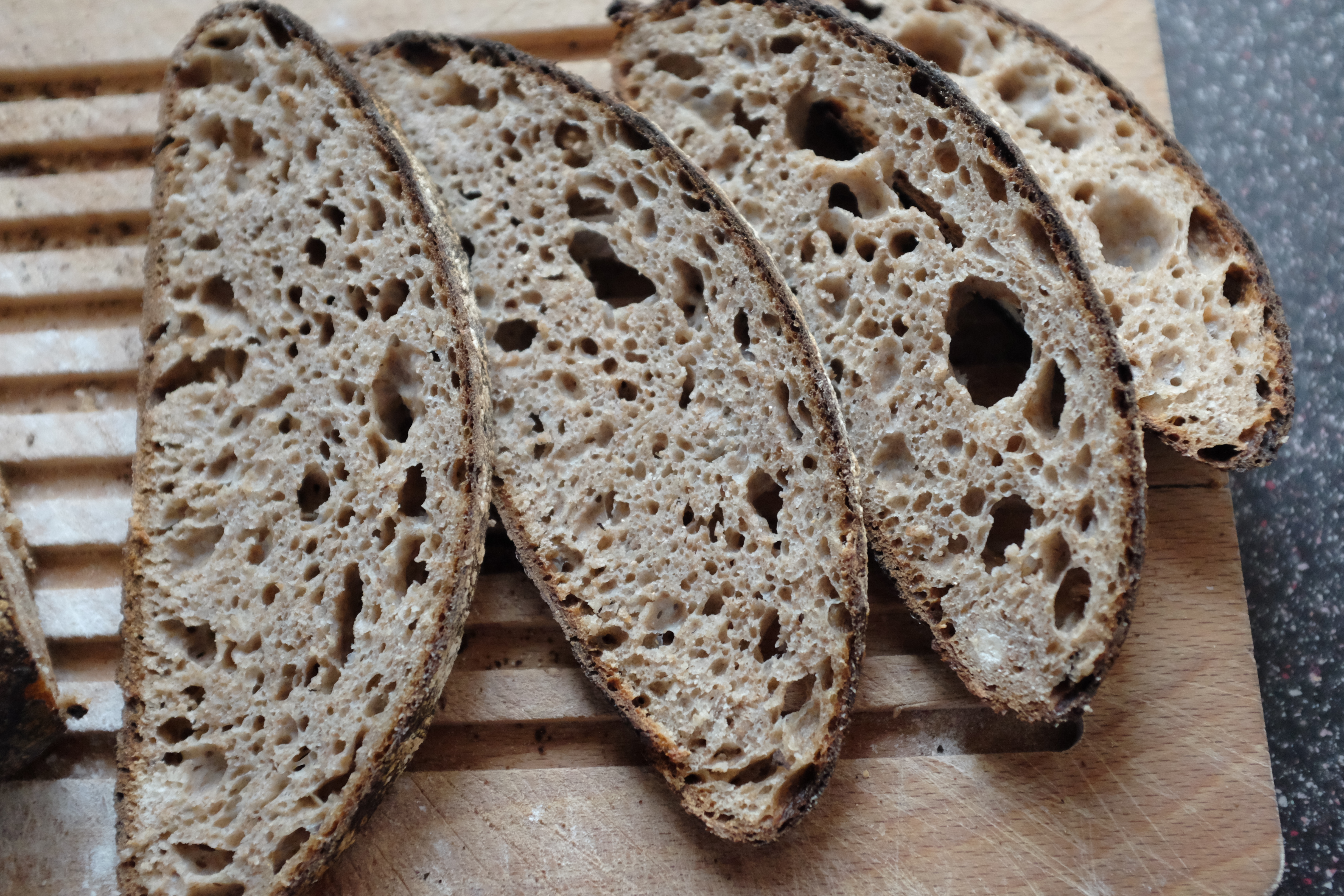 A close-up photograph of the crumb of the “Wholemeal Sourdough with a Splash of Rye” bread